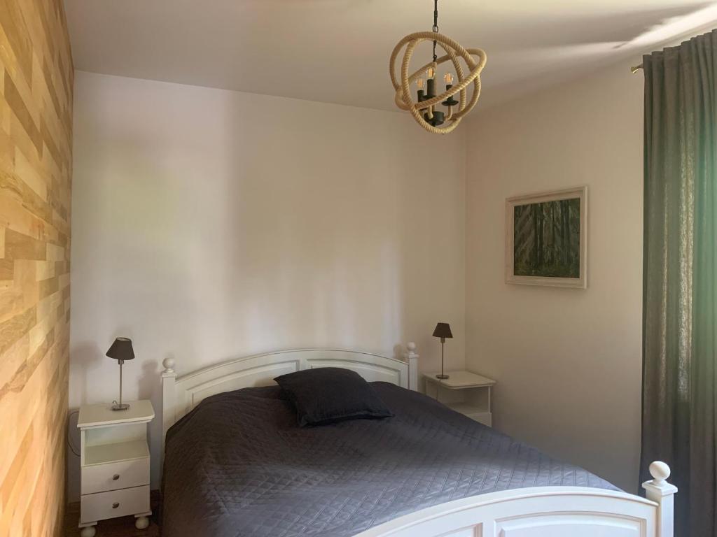 Postel nebo postele na pokoji v ubytování Apartament na Wzgórzu