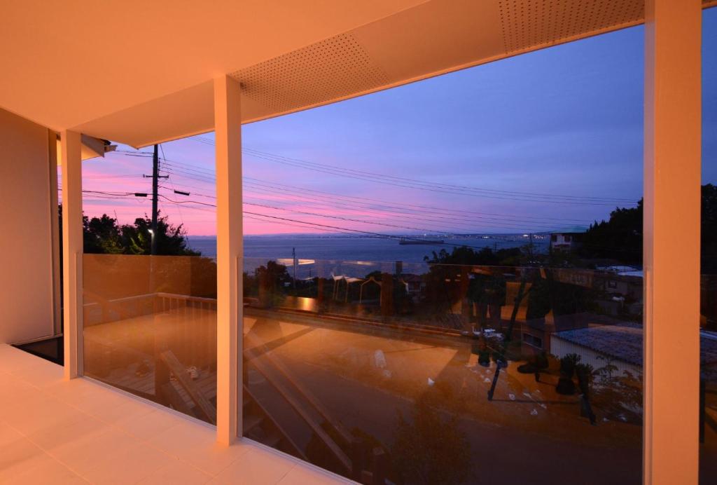 a view from a window of a city at dusk at Awaji Villa Forest - Vacation STAY 44333v in Awaji