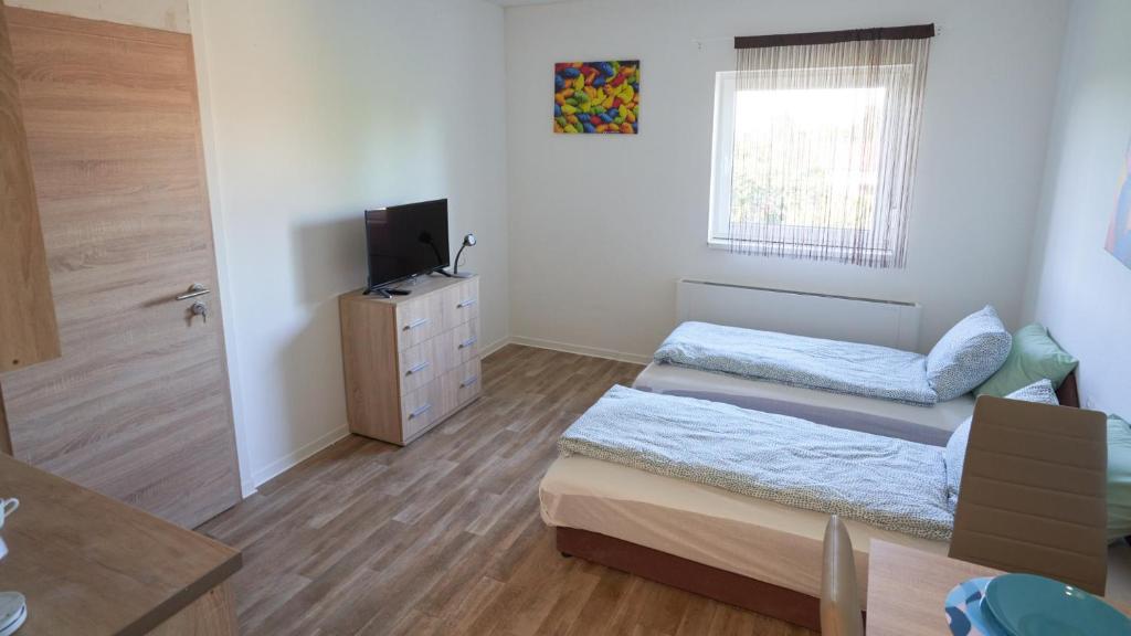 Postel nebo postele na pokoji v ubytování Thermal Apartman - EM