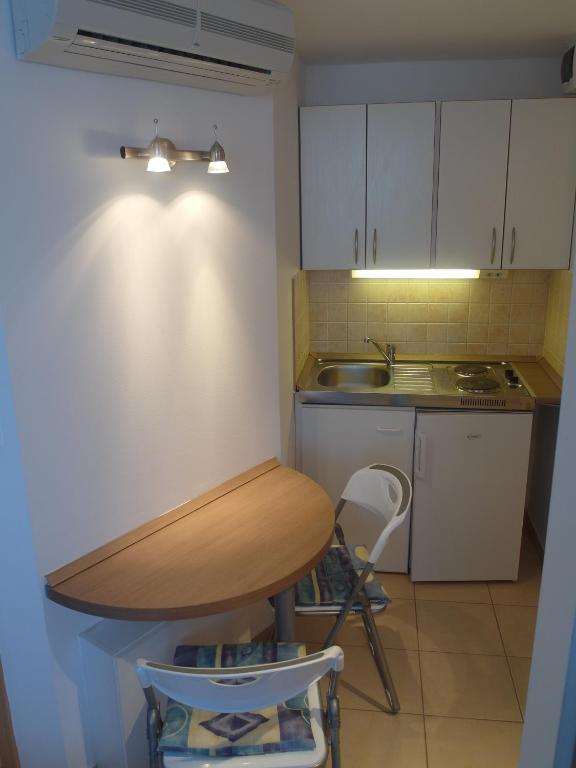 Kuchyňa alebo kuchynka v ubytovaní Tip-Top Apartmenthouse