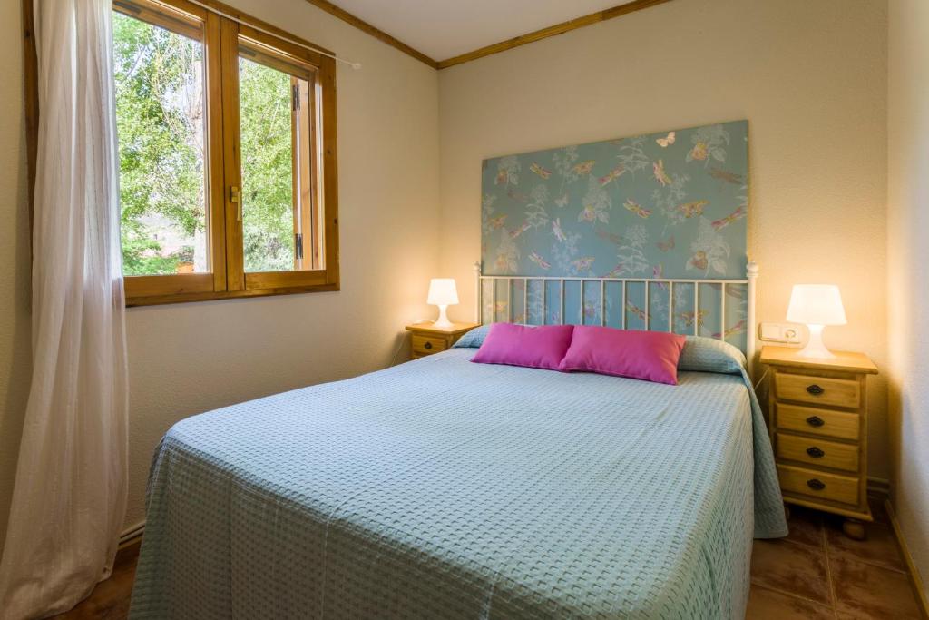 Posteľ alebo postele v izbe v ubytovaní Apartamentos Turísticos Matagacha