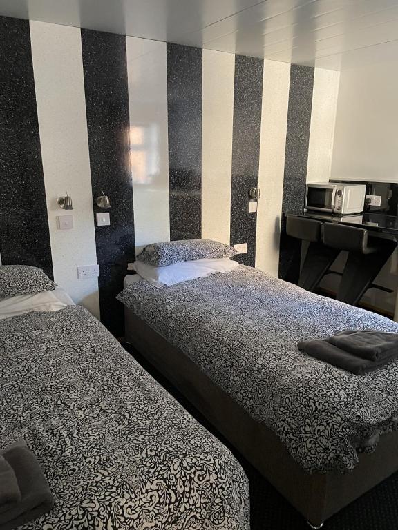 Postel nebo postele na pokoji v ubytování Bentleys