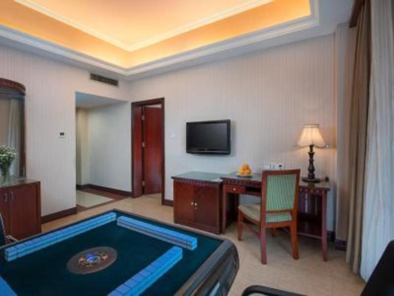a room with a pool table in a hotel room at Vienna Hotel Nanchang Railway Staion in Nanchang