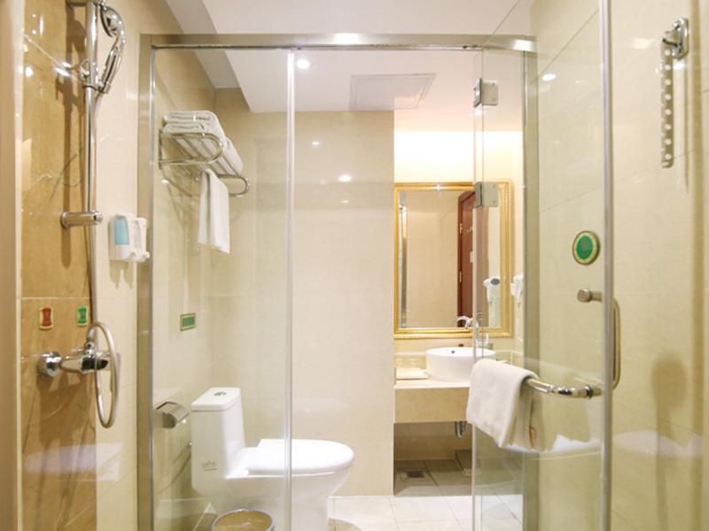 a bathroom with a shower and a toilet and a sink at Vienna Hotel Changsha Mid Furong Road in Changsha