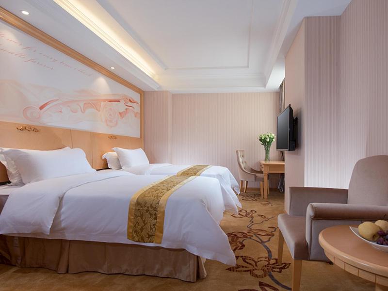 Postel nebo postele na pokoji v ubytování Vienna 3 Best Hotel Shenzhen South University of Science and Technology of China