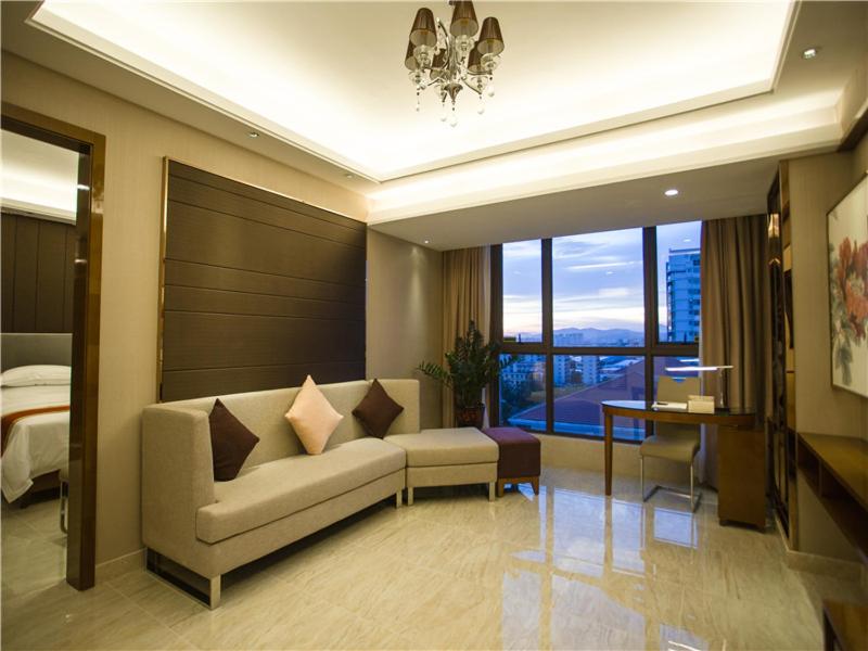 a living room with a couch and a table at Vienna Hotel Sanya Sanya Bay in Sanya