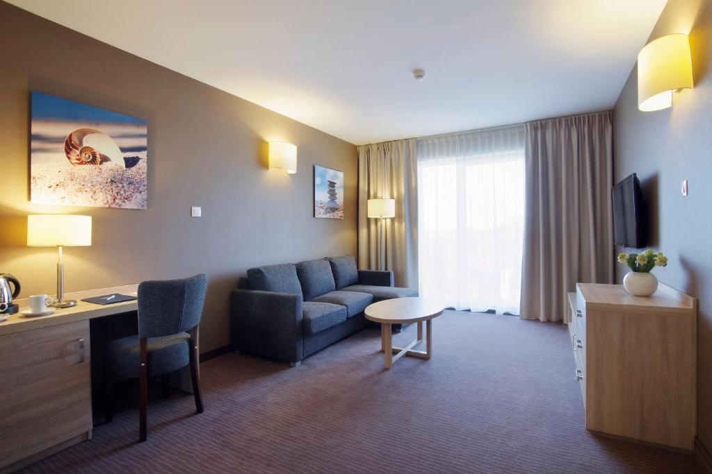 TV a/nebo společenská místnost v ubytování Tristan Hotel & SPA