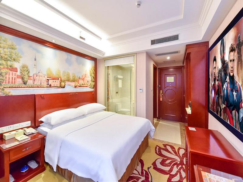 Postel nebo postele na pokoji v ubytování Vienna Hotel Shenzhen Bao'an Xin'an