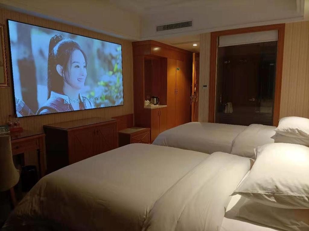 TV a/nebo společenská místnost v ubytování Vienna Hotel (Quanzhou Bus Station)
