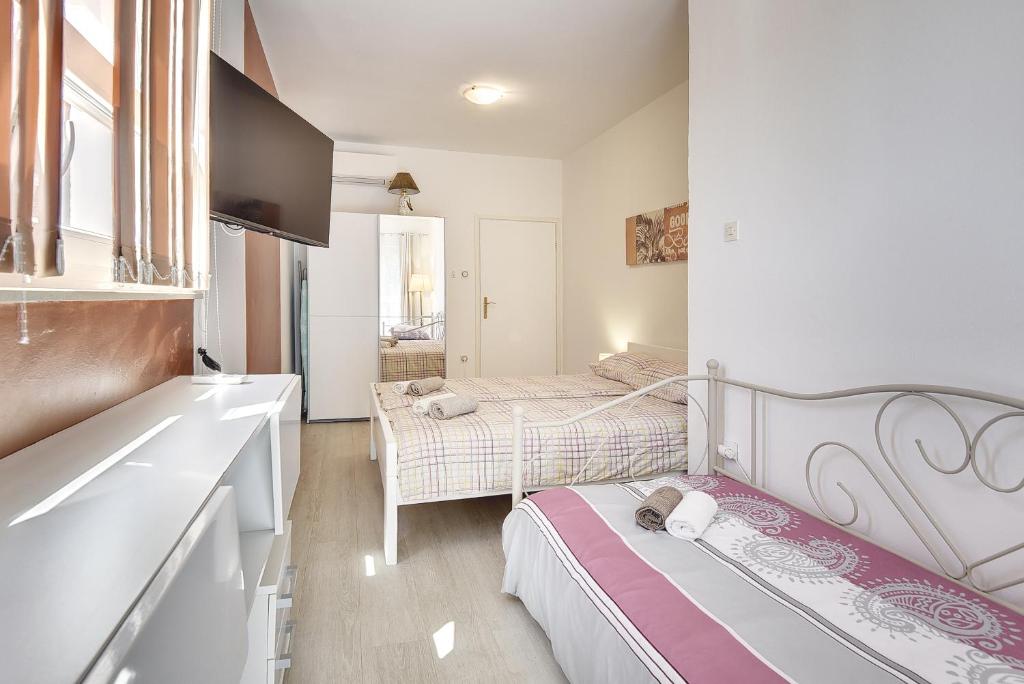 Łóżko lub łóżka w pokoju w obiekcie Villa Golf