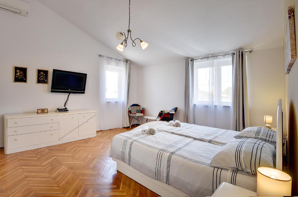 Łóżko lub łóżka w pokoju w obiekcie Villa Golf
