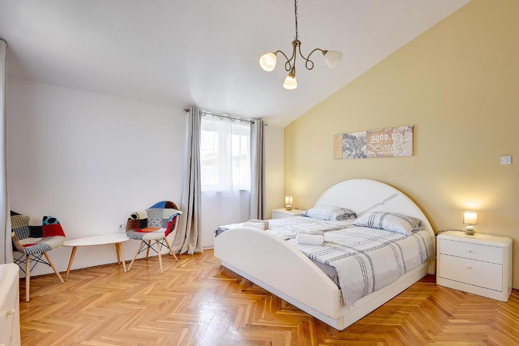 Łóżko lub łóżka w pokoju w obiekcie Villa Golf