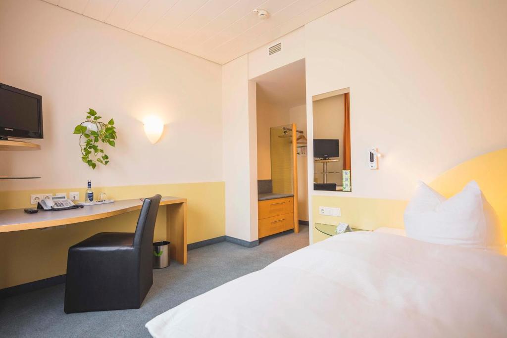 Postel nebo postele na pokoji v ubytování Hotel Luise