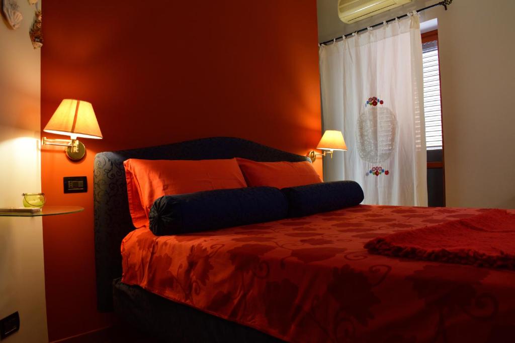 Postel nebo postele na pokoji v ubytování B&B Le Casette Di Lù