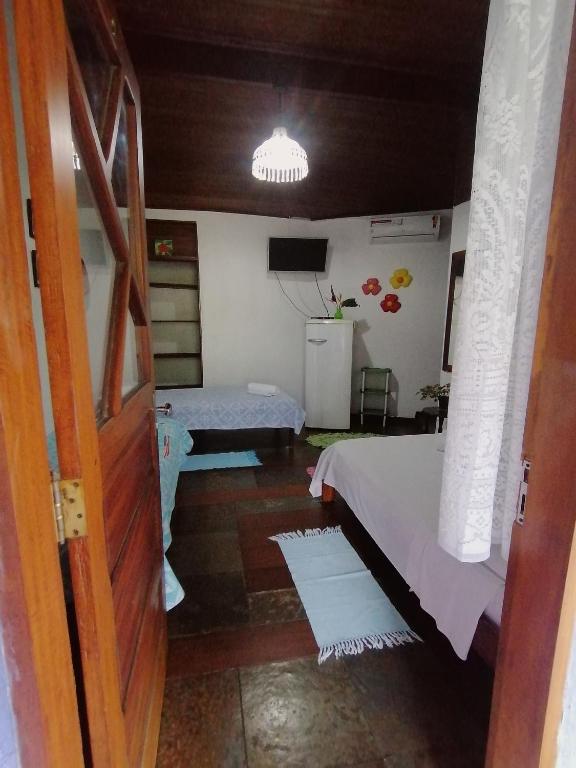 Postel nebo postele na pokoji v ubytování Pousada Recanto dos Pássaros