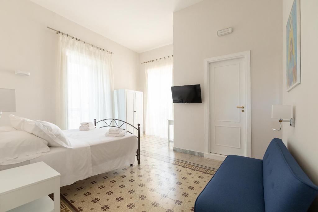 Posteľ alebo postele v izbe v ubytovaní EFFE SUITES
