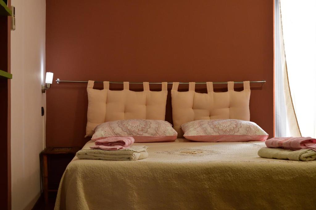 Postel nebo postele na pokoji v ubytování B&B Le Casette Di Lù