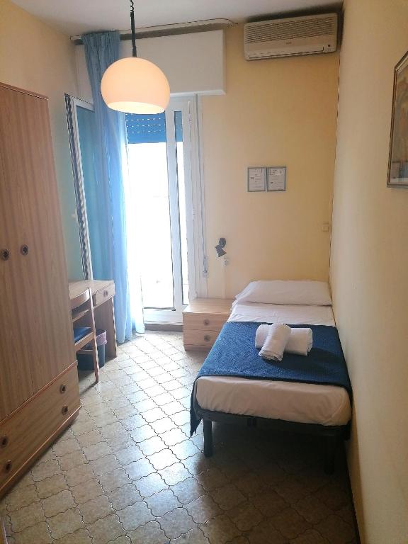 Postel nebo postele na pokoji v ubytování Hotel Danieli