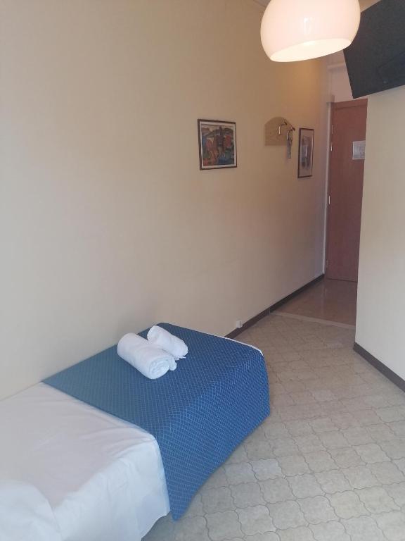 Postel nebo postele na pokoji v ubytování Hotel Danieli