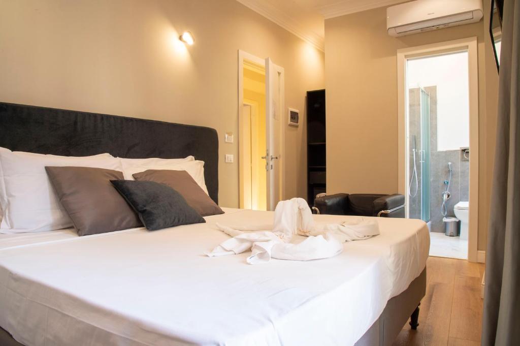 Posteľ alebo postele v izbe v ubytovaní AD Suites Tritone