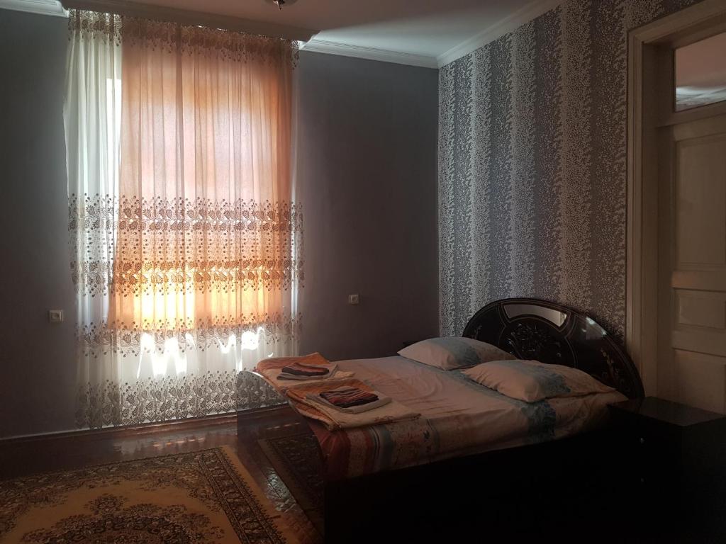 Postel nebo postele na pokoji v ubytování Guest House Adigeni