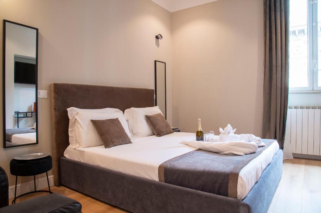 Posteľ alebo postele v izbe v ubytovaní AD Suites Tritone