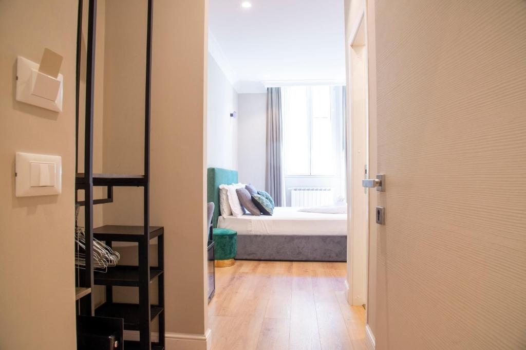 Posteľ alebo postele v izbe v ubytovaní AD Suites Tritone