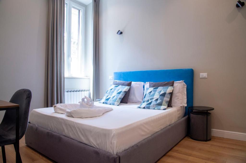 Posteľ alebo postele v izbe v ubytovaní AD Suites Tritone