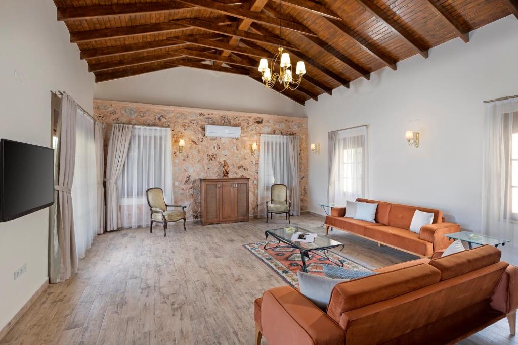 TV a/nebo společenská místnost v ubytování Kairos Hotel