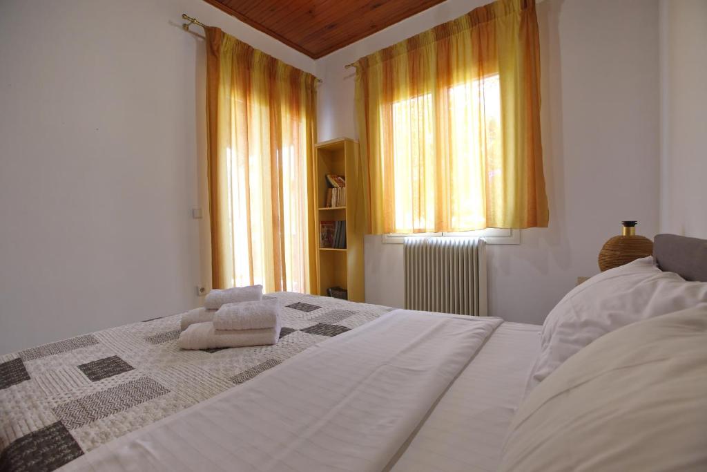 Postel nebo postele na pokoji v ubytování Villa Ioanna