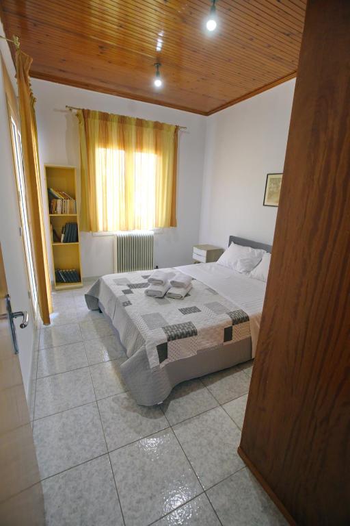 Postel nebo postele na pokoji v ubytování Villa Ioanna