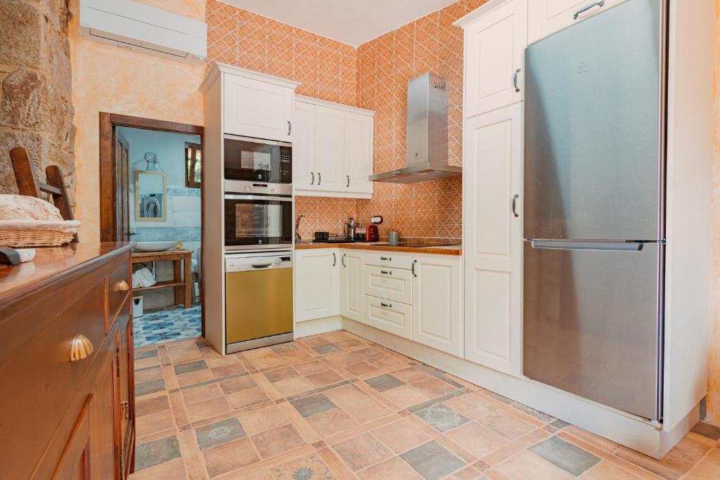 Kuchyň nebo kuchyňský kout v ubytování Casa Escondida Aveiga