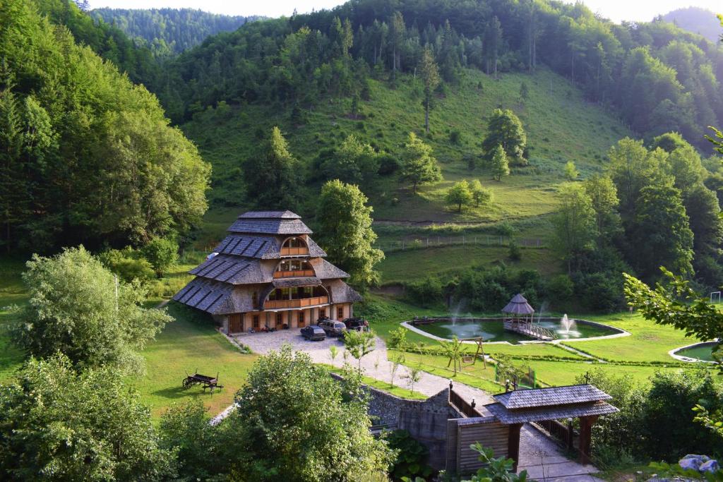 an aerial view of a house in the mountains at Farmstay Oka i Po in Berane