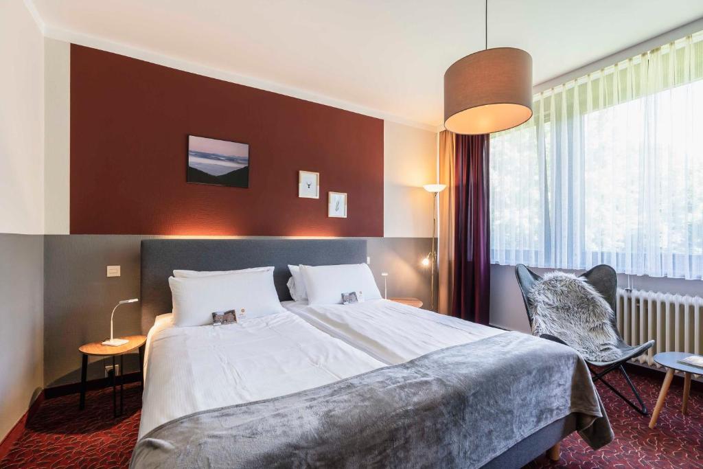 Postel nebo postele na pokoji v ubytování Flair Hotel Zur Eiche