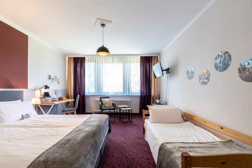 Postel nebo postele na pokoji v ubytování Flair Hotel Zur Eiche