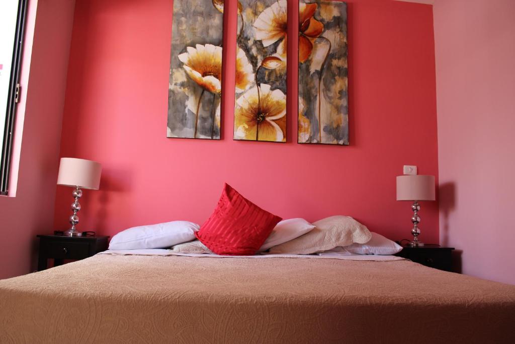 Postel nebo postele na pokoji v ubytování Hotel Boutique La Orquidea
