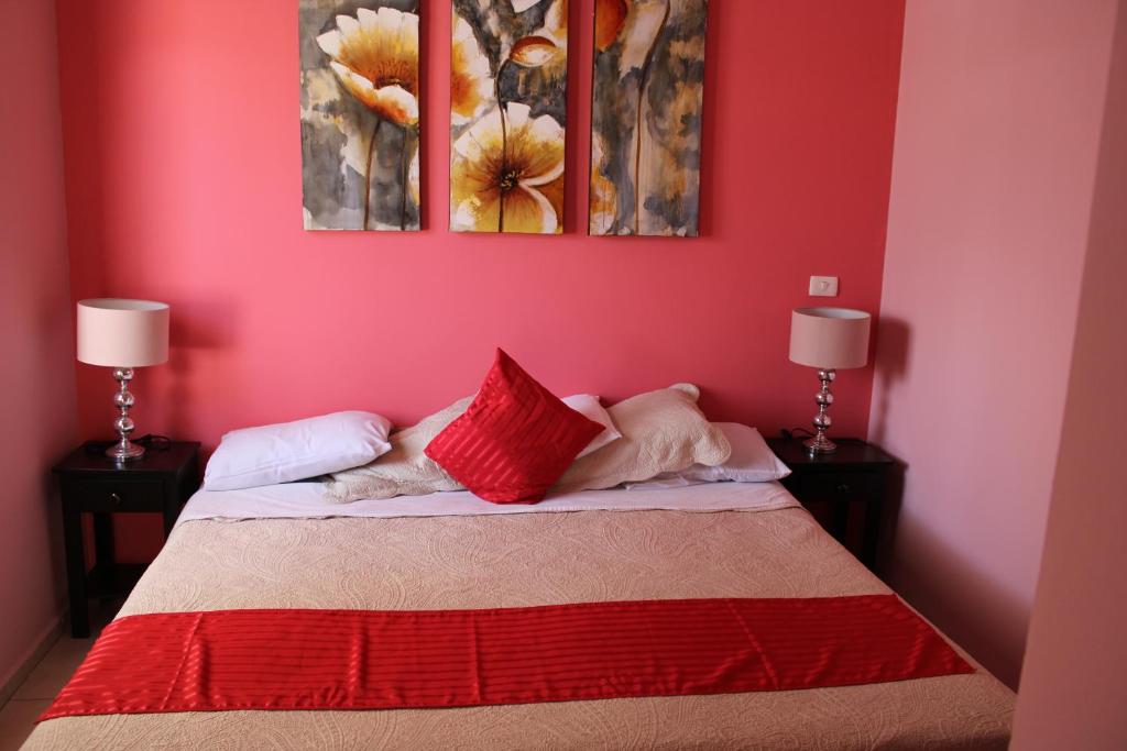 Postel nebo postele na pokoji v ubytování Hotel Boutique La Orquidea