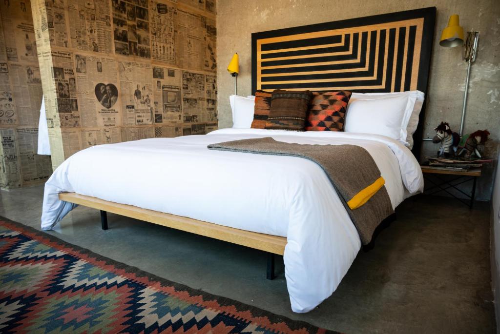Postel nebo postele na pokoji v ubytování Hotel Boutique Lafayette Tijuana
