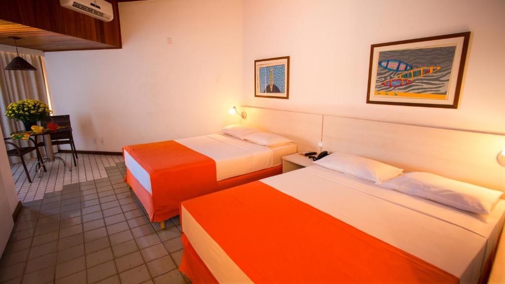 Postel nebo postele na pokoji v ubytování Monte Pascoal Praia Hotel