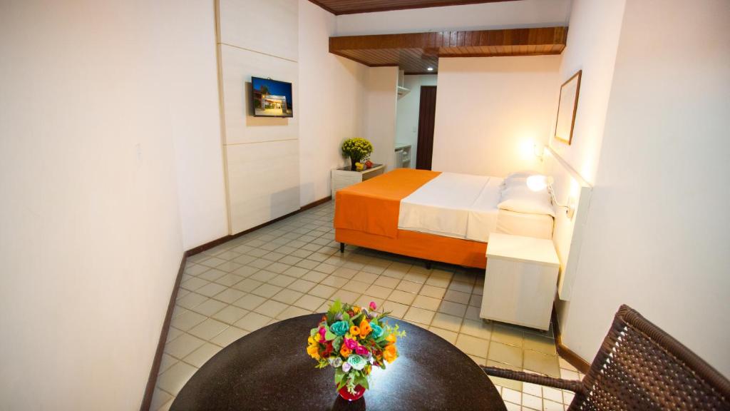 Postel nebo postele na pokoji v ubytování Monte Pascoal Praia Hotel
