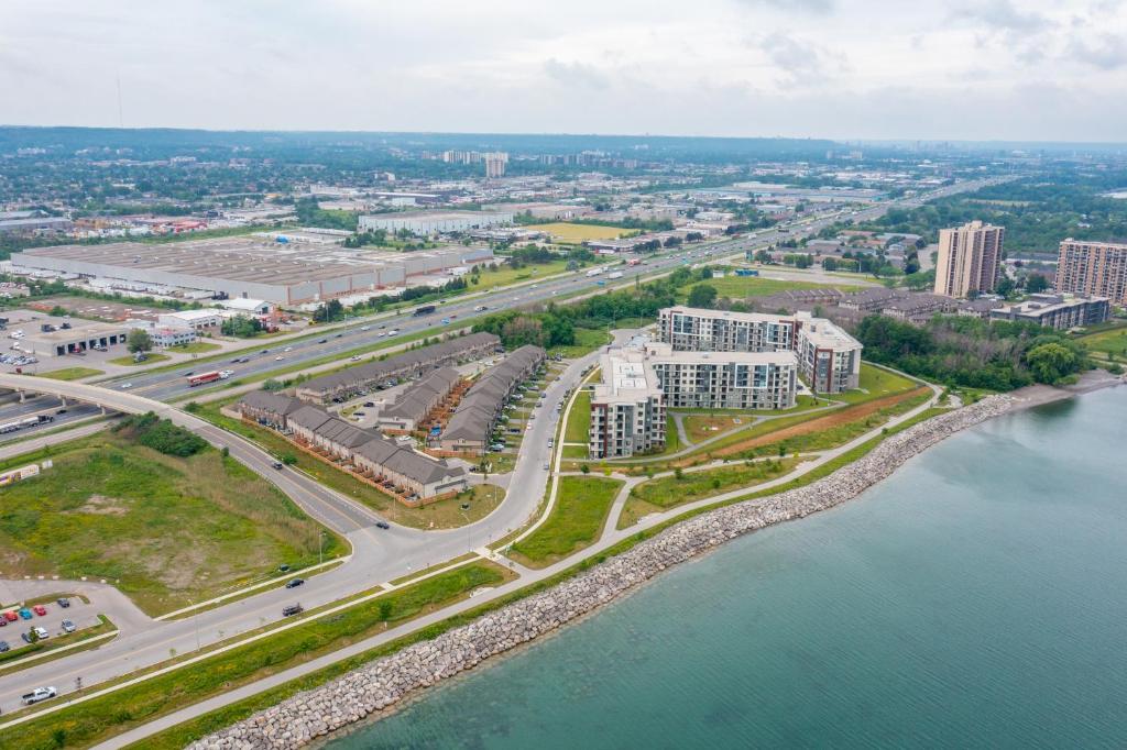 an aerial view of a city next to the water at Modern Hamilton Homes Lake Ontario Shore by GLOBALSTAY in Hamilton
