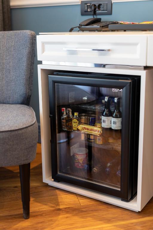 a fireplace with bottles of beer inside of it at Motif Hotel Çeşme in Çeşme