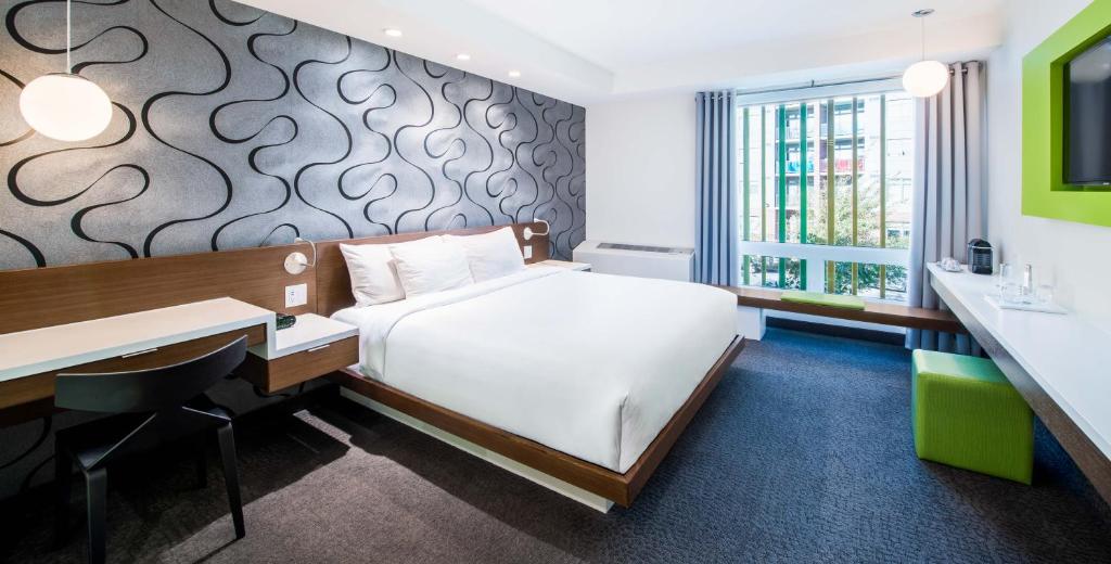 Postel nebo postele na pokoji v ubytování Mere Hotel