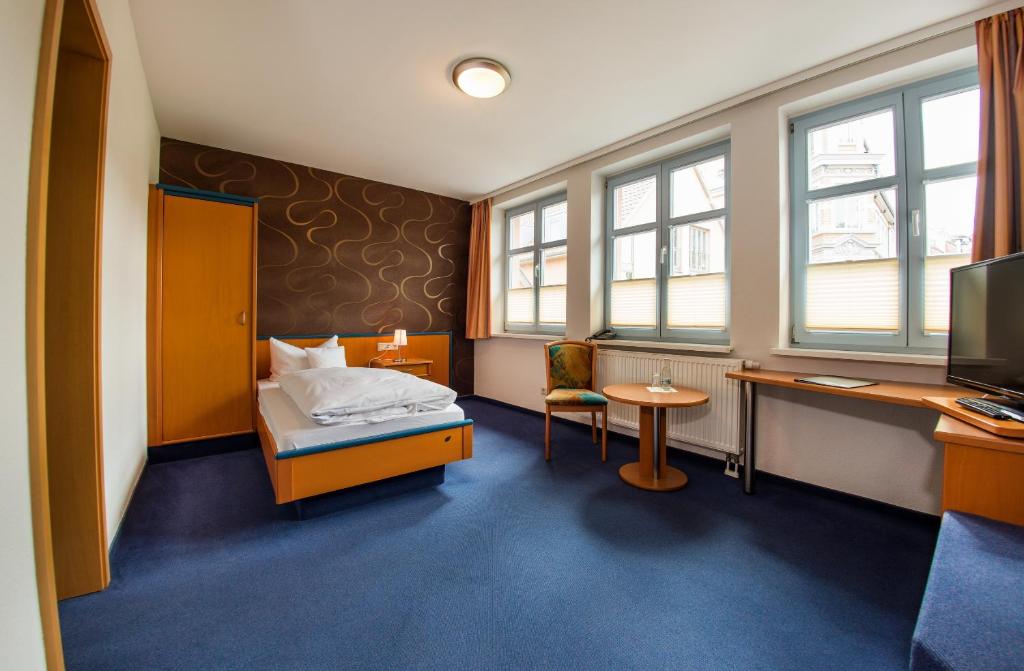 Postel nebo postele na pokoji v ubytování B&S Hotel Am Bachhaus