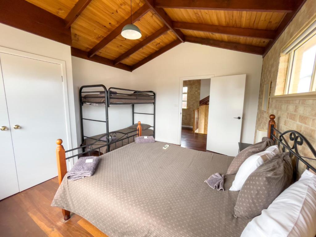 a bedroom with a bunk bed in a house at Esperance Foreshore Apartments in Esperance