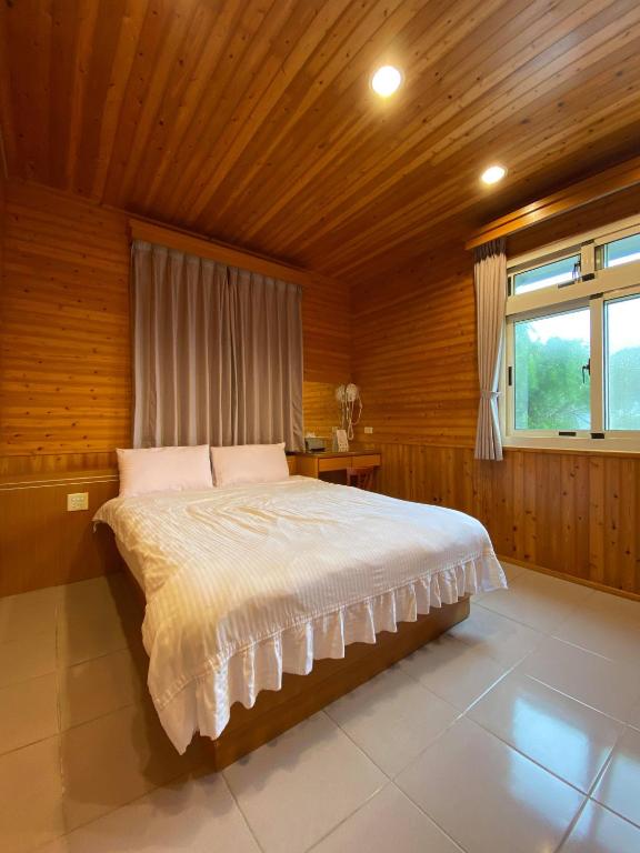 Postel nebo postele na pokoji v ubytování Tianyi Homestay