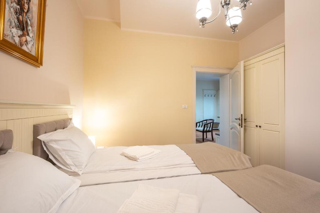 Postel nebo postele na pokoji v ubytování Apartament Hotel H