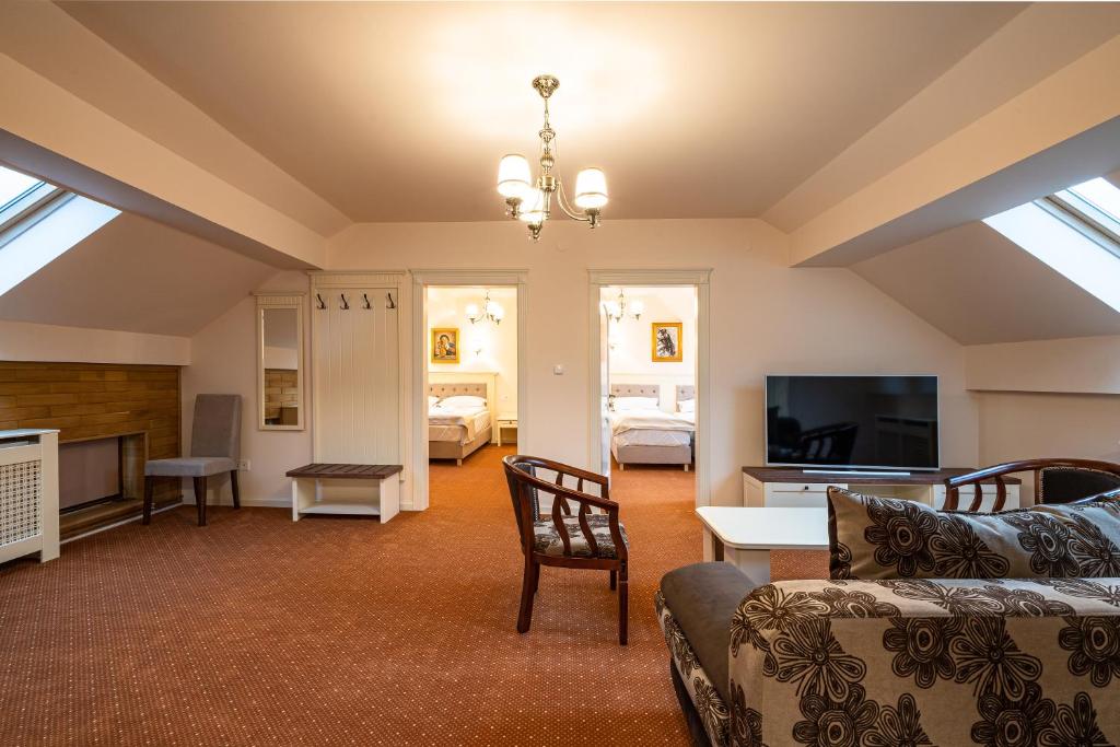 TV a/nebo společenská místnost v ubytování Apartament Hotel H