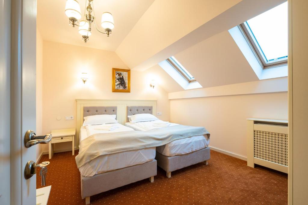 Postel nebo postele na pokoji v ubytování Apartament Hotel H