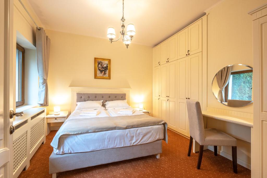 Postel nebo postele na pokoji v ubytování Apartament Hotel H